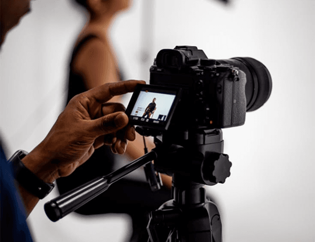Photographer reviewing a shot on set